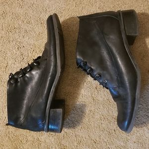 worn black leather ankle boots